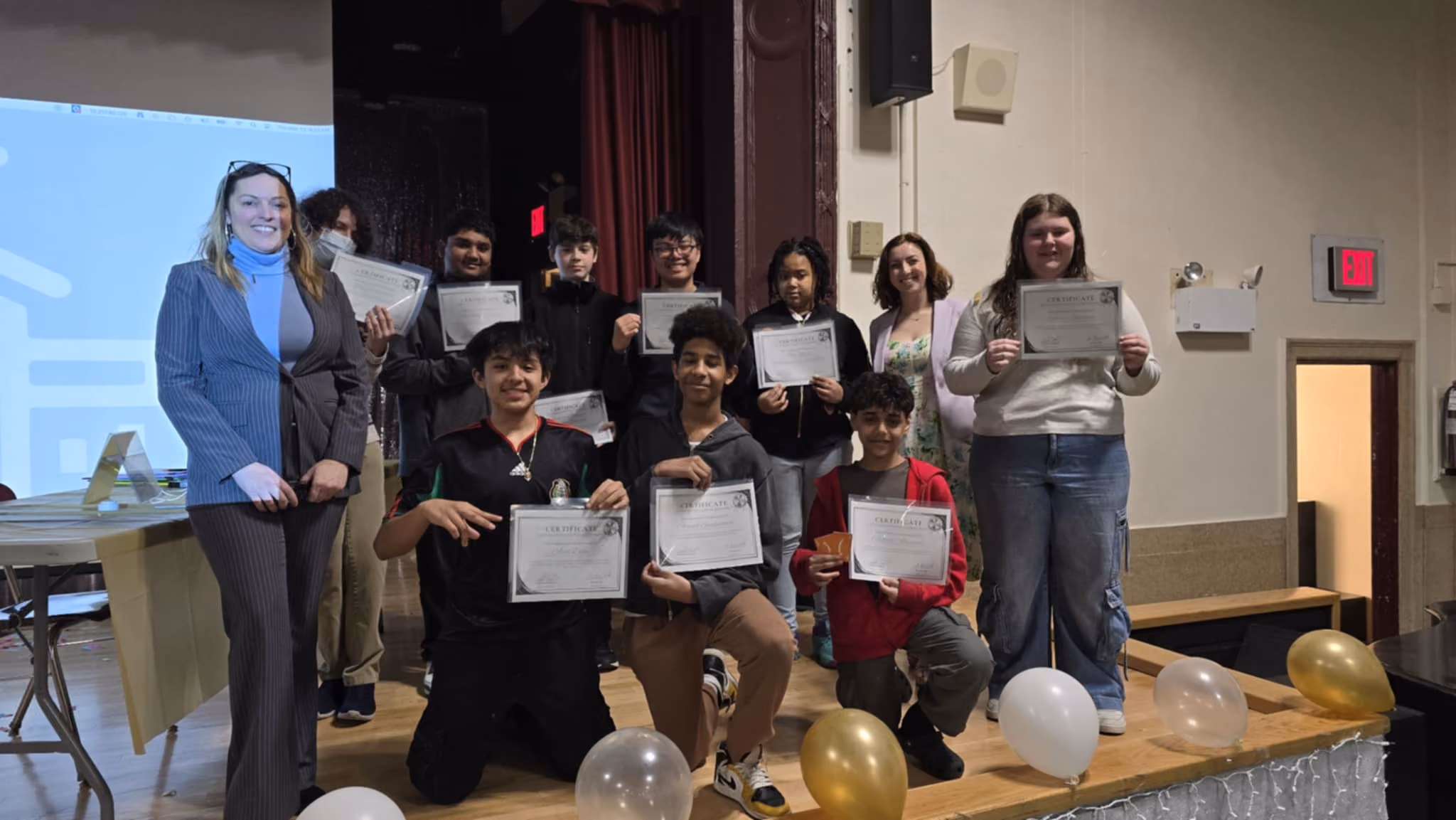 MAA and RBG Jeopardy participants holding certificates with teachers
