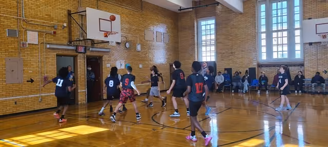 I.S. 141 basketball players on the court during a game