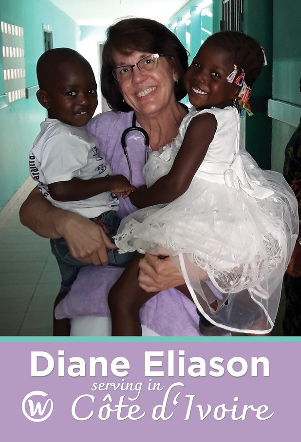 Diane Eliason holding two young children at the Baptist Hospital in Côte d'Ivoire