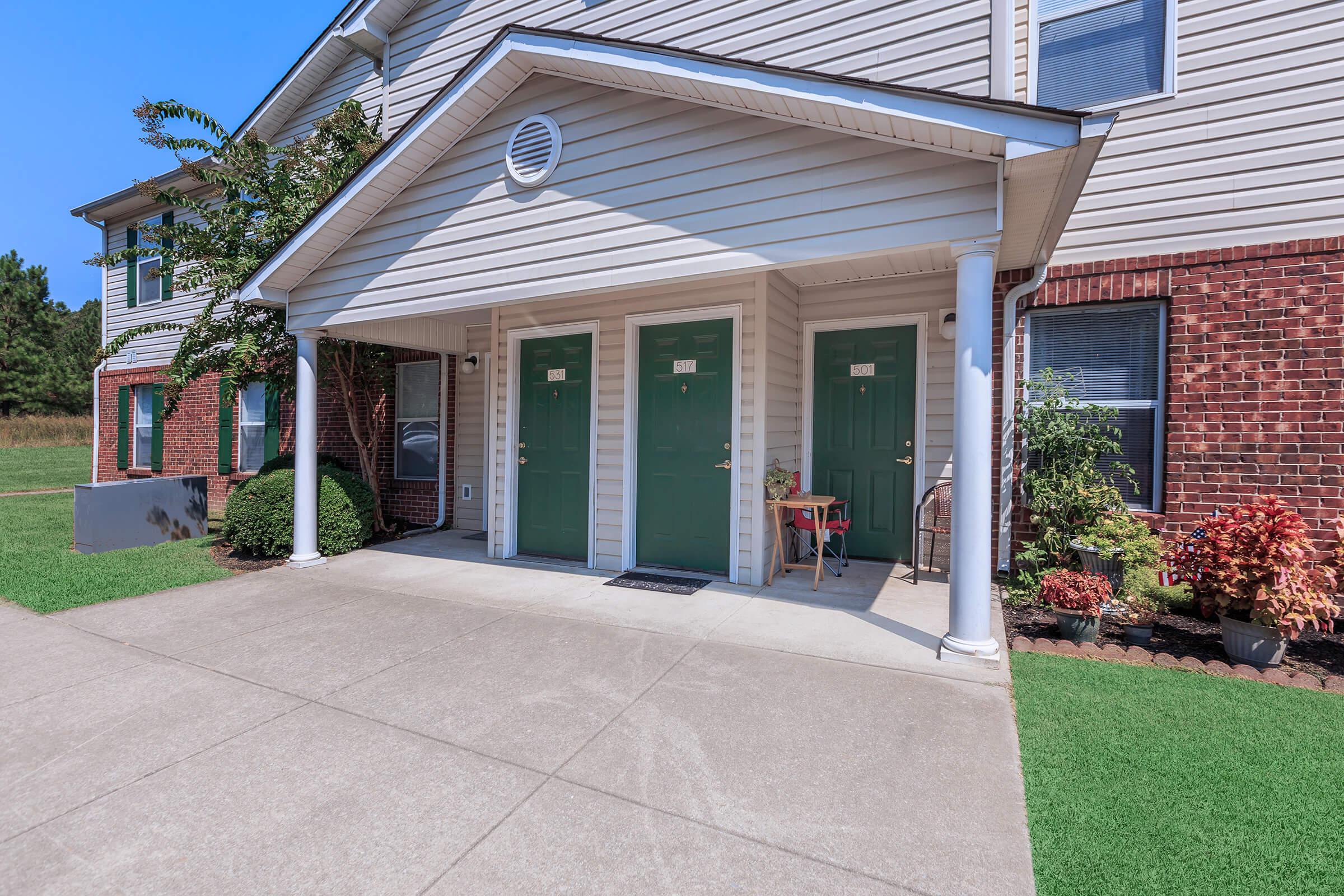 Apartment building exterior with unit entryways