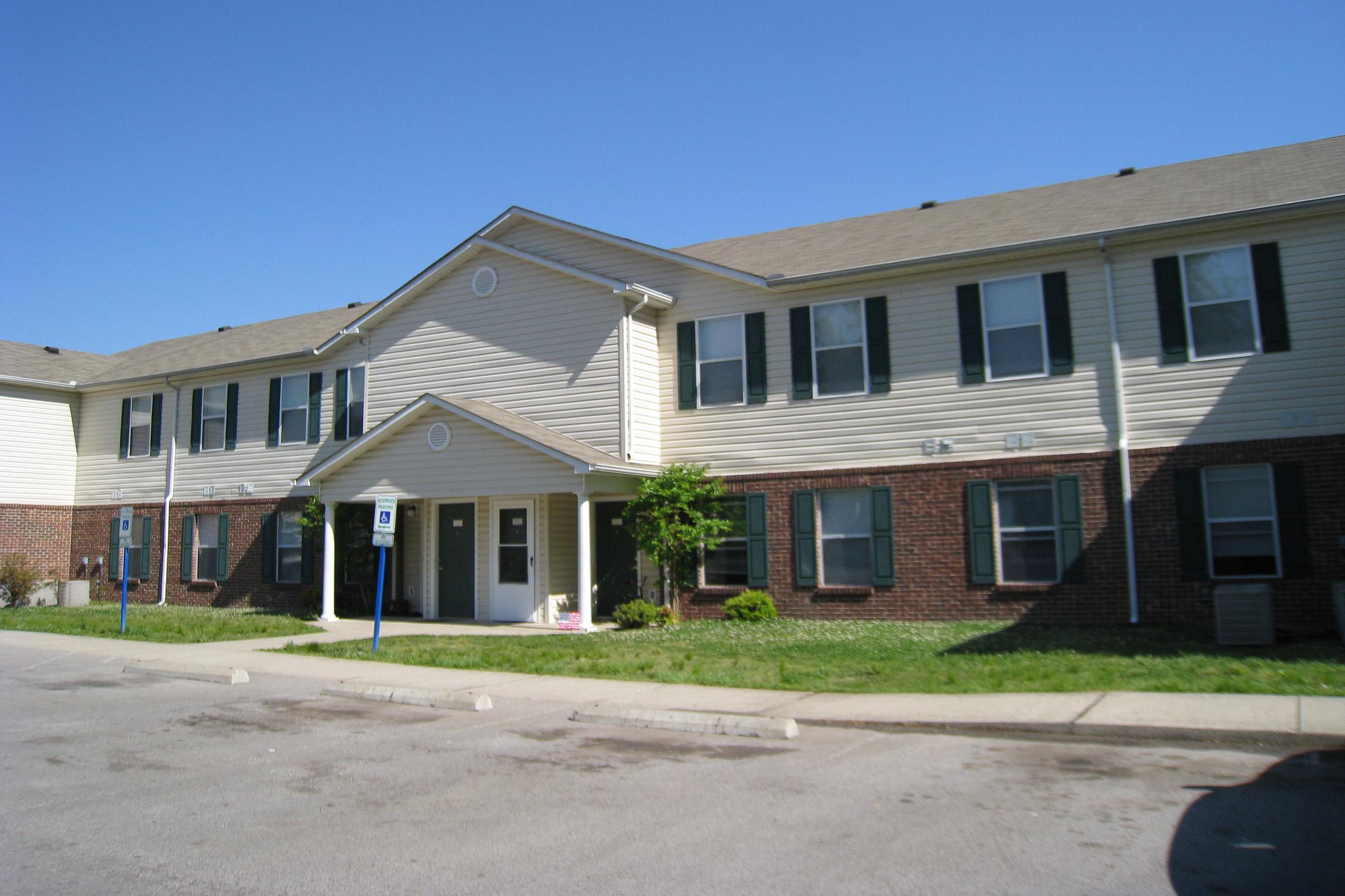 Apartment building exterior with parking area