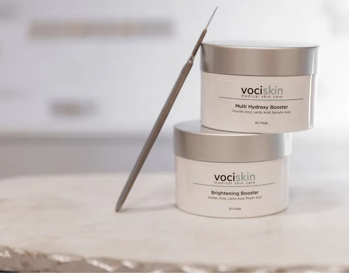 VociSkin Multi-Hydra Booster and Brightening Booster jars on a marble surface