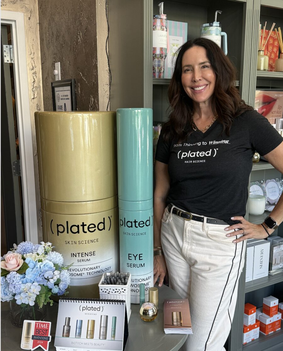 Plated Skin Science display with oversized serum bottles