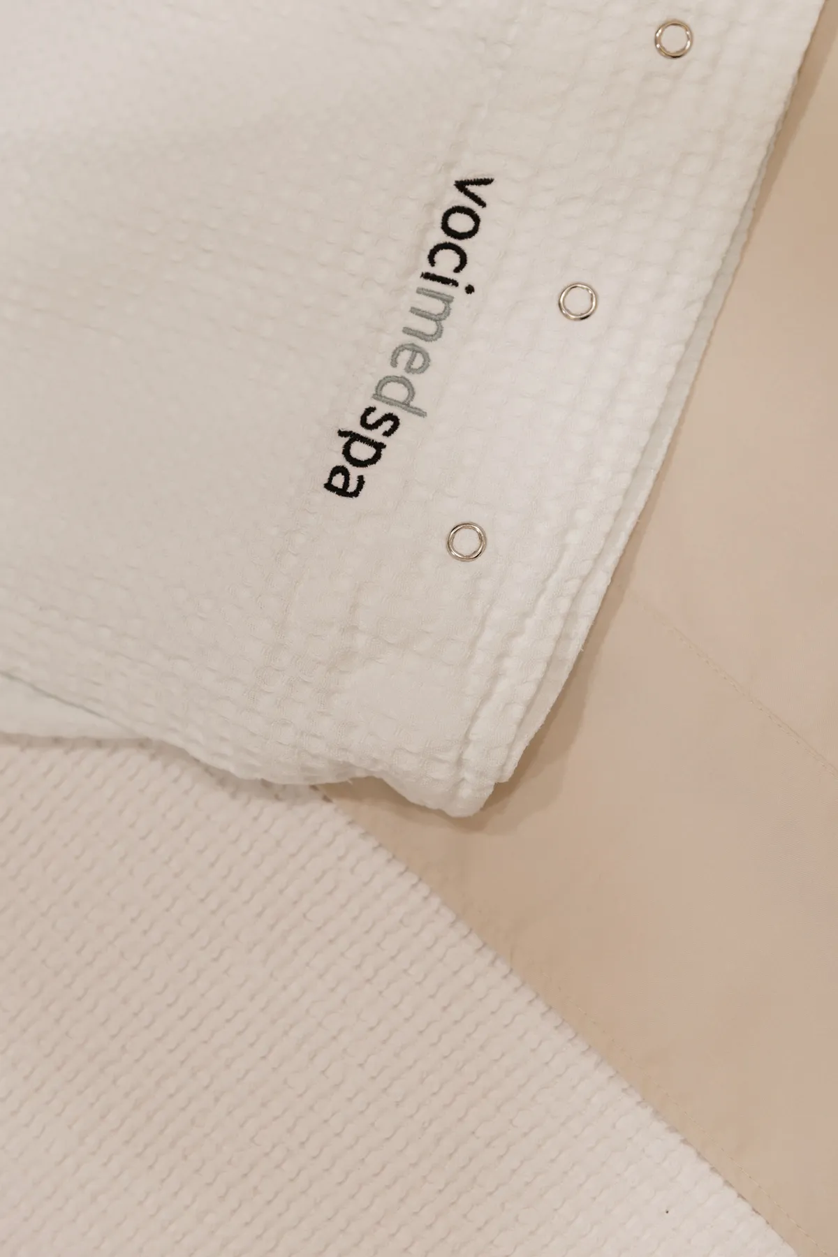 Waffle-weave Voci MedSpa robe embroidered with the vocimedspa logo