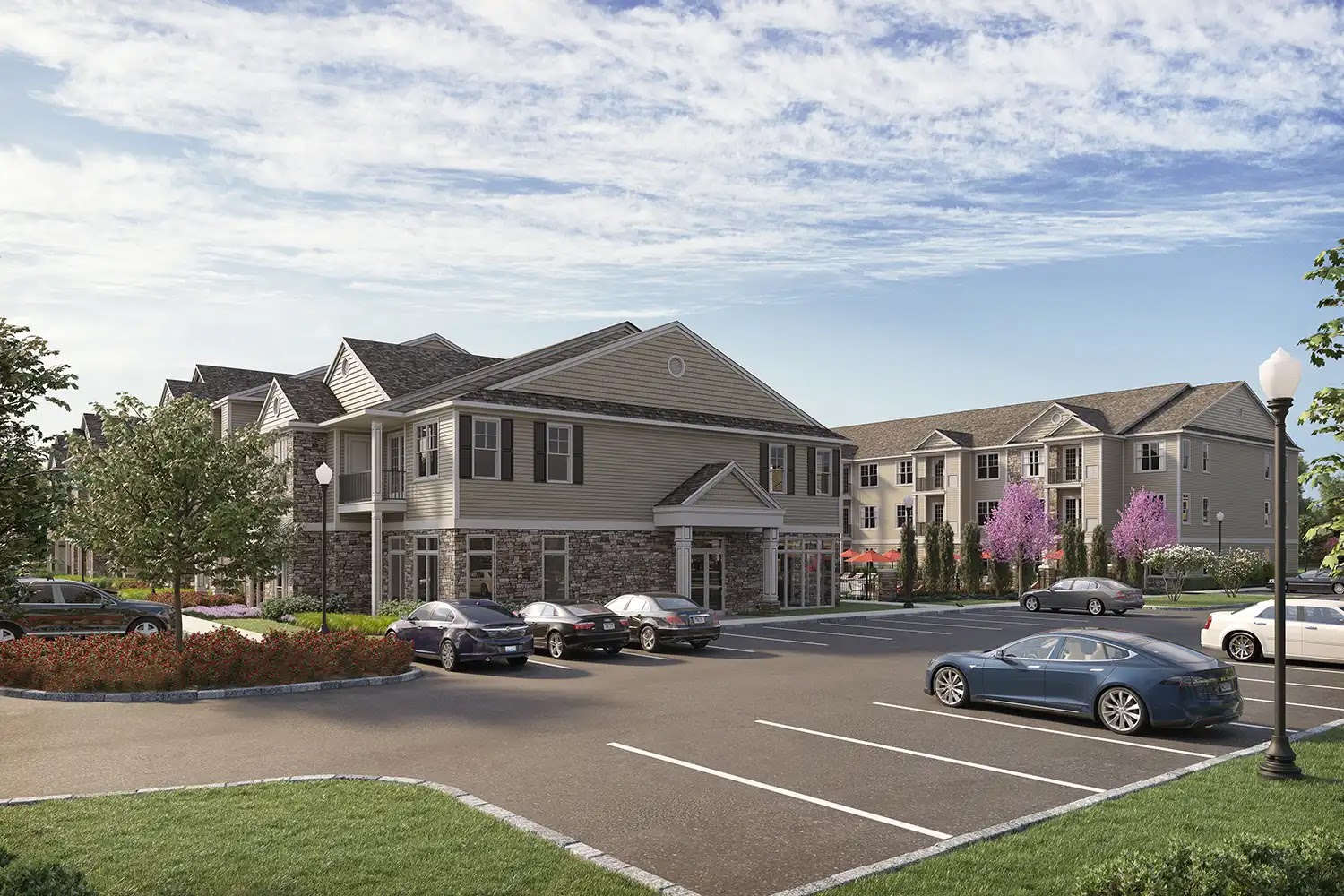 Rendering of a multifamily residential building with landscaped courtyard.