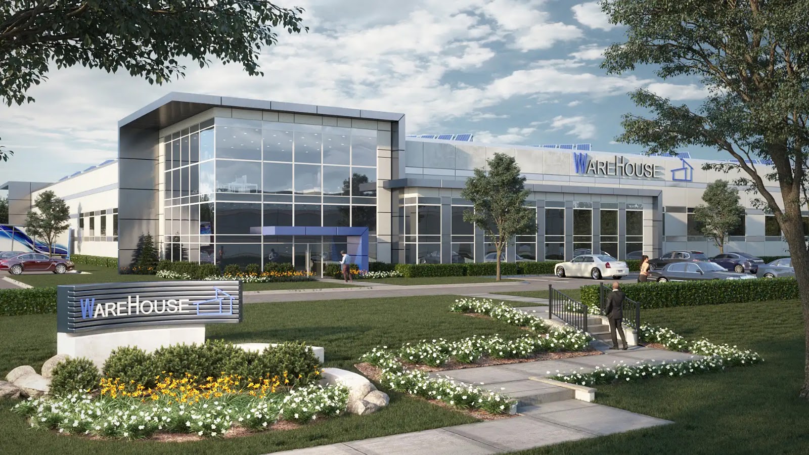 Exterior view of a modern warehouse with landscaped entrance.