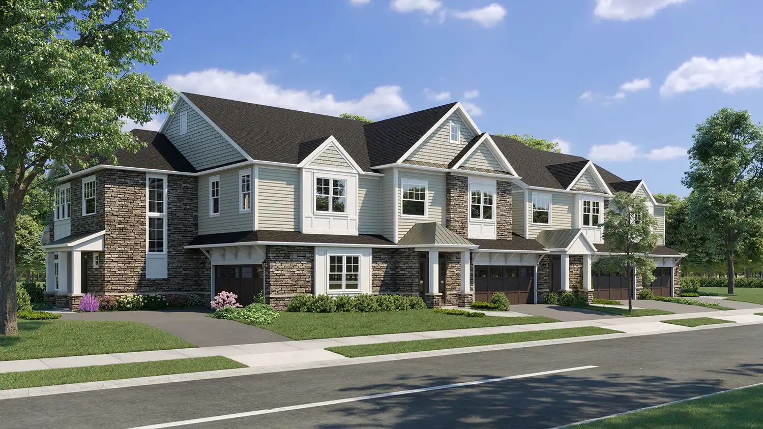 Exterior view of a multifamily residential building with stone and siding.