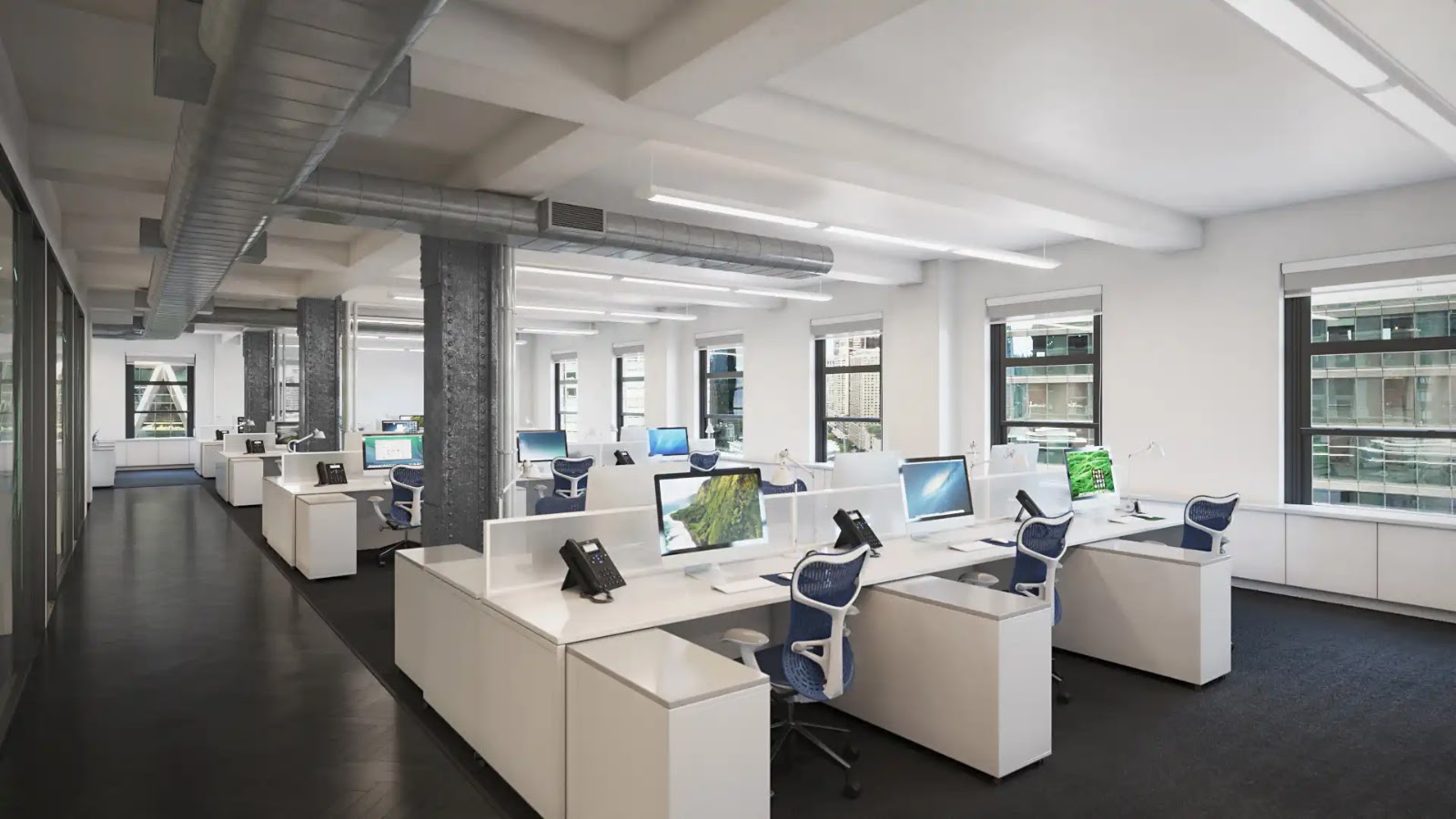 Bright modern office interior with workstations and large windows.