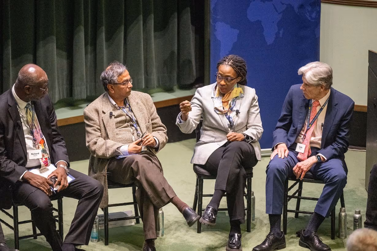 Four members speaking on a panel at Global Health Equity research symposium at University of Michigan