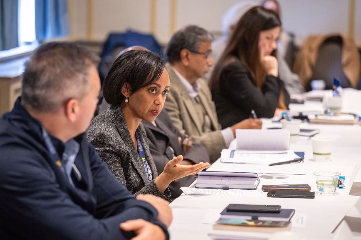 Woman speaking at board meeting for Center for Global Health Equity at University of Michigan
