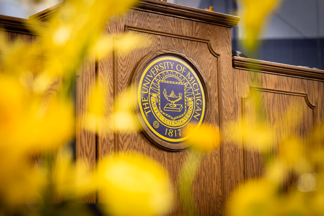 University of Michigan crest on podium