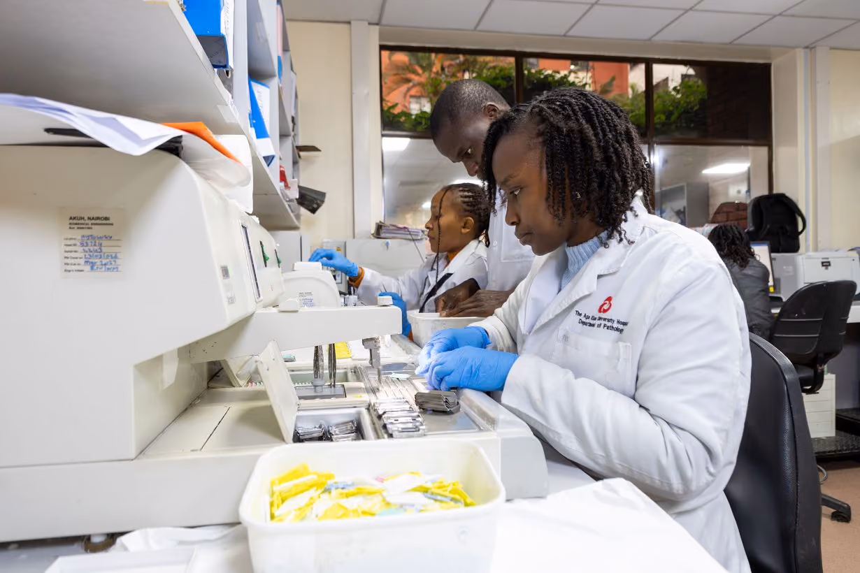 Two cancer researchers processing data samples in Kenya for CRC AI project photo by Dann Mchoraji