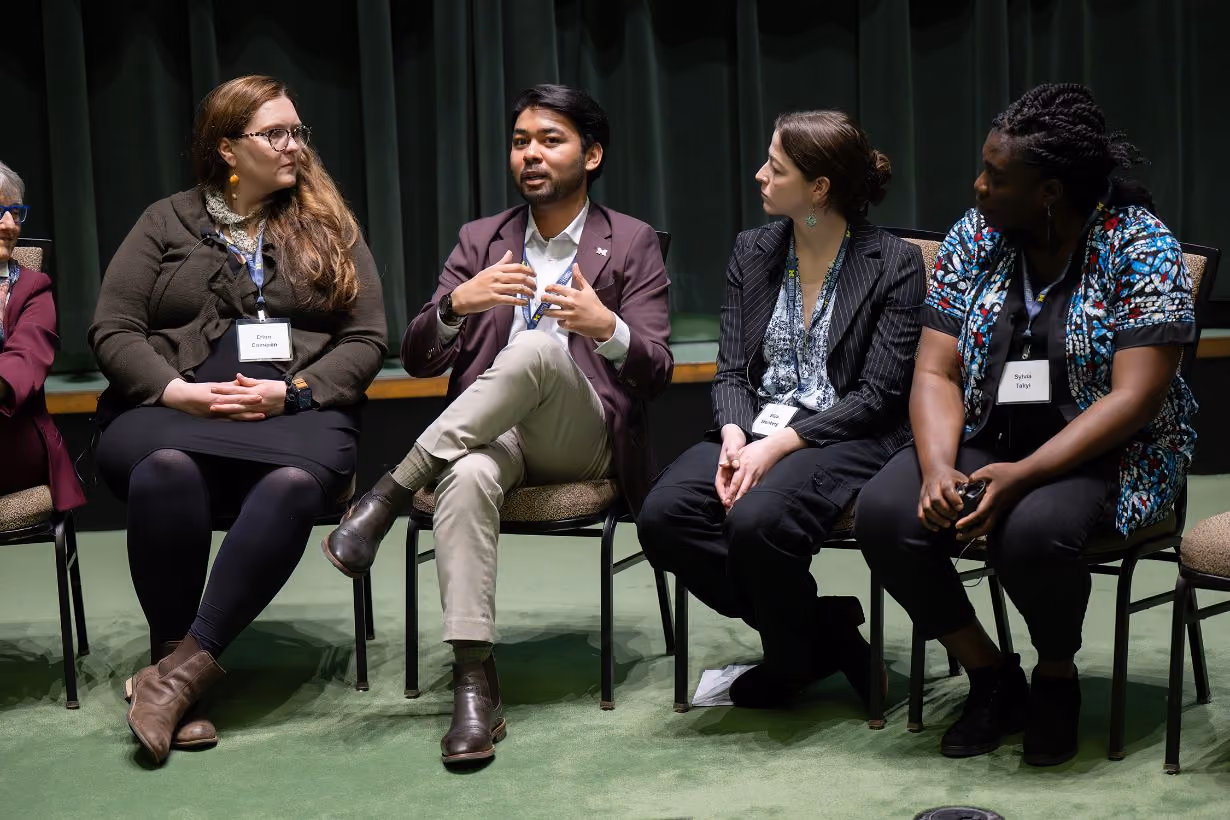 Four student researchers and impact scholars speaking on a panel at Center for Global Health Equity research symposium at University of Michigan