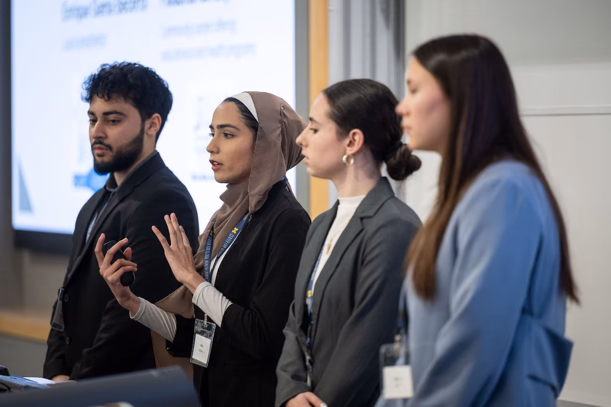 Four students students presenting funding pitch project during Center for Global Health Equity student organization pitch competition at the University of Michigan