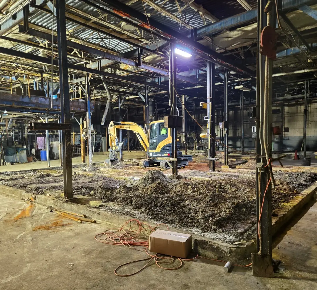 excavator digging in industrial site