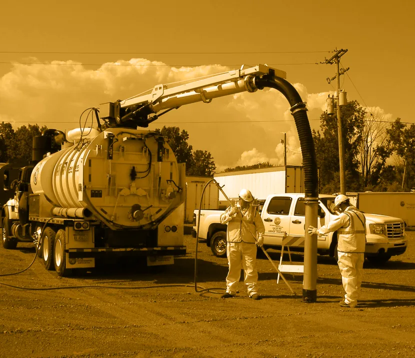 waste truck getting waste out of under ground tank gold overlay
