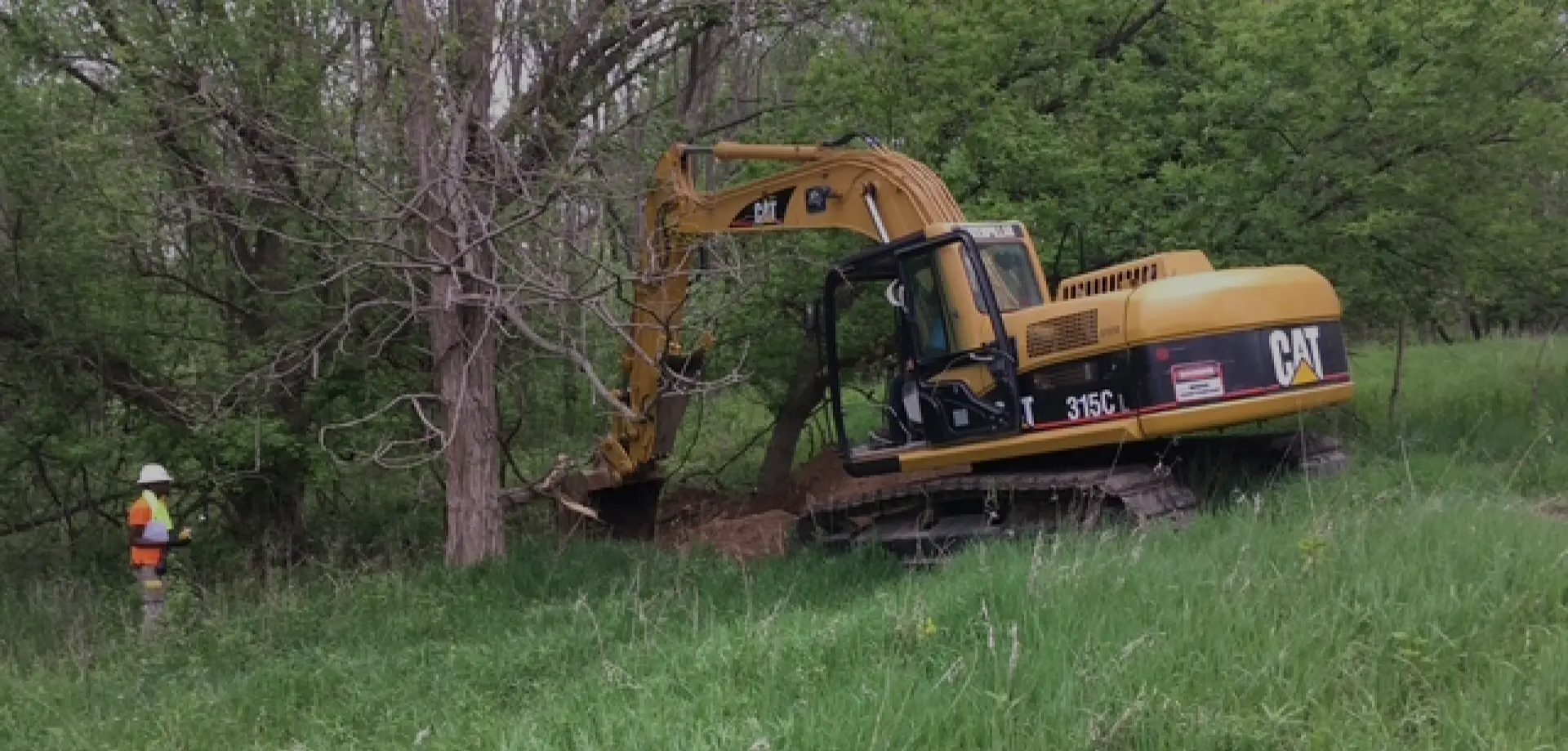 excavator digging a test pit