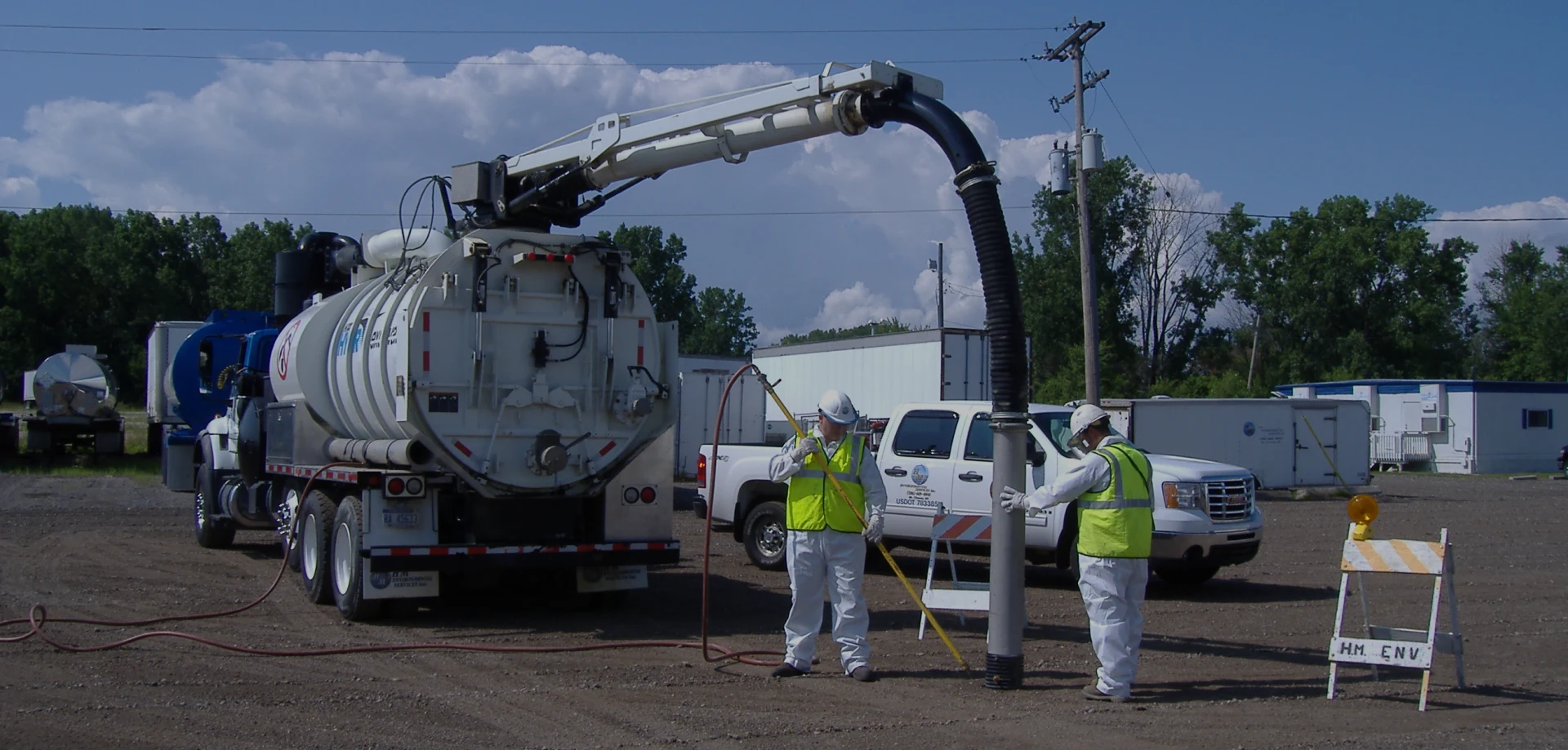 waste tank truck pumping from underground tank overlay