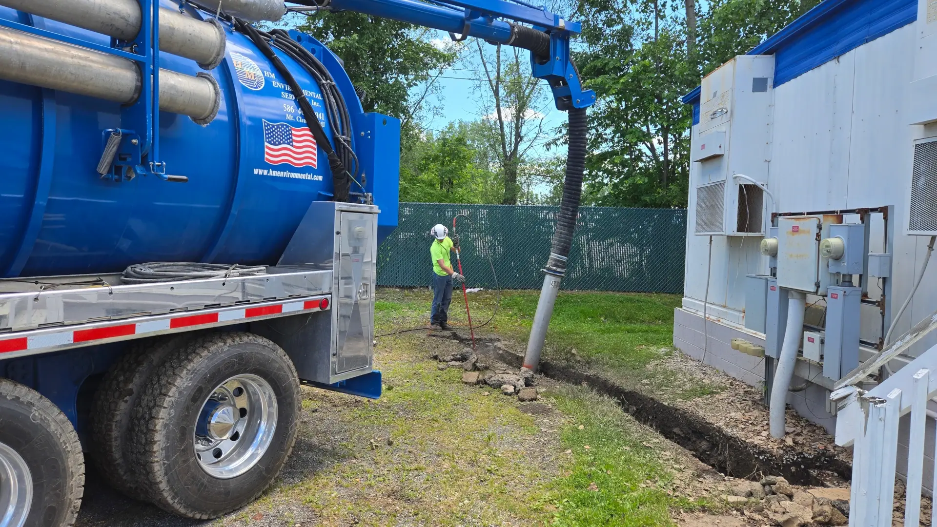 hm branded hydro truck pumping liquid