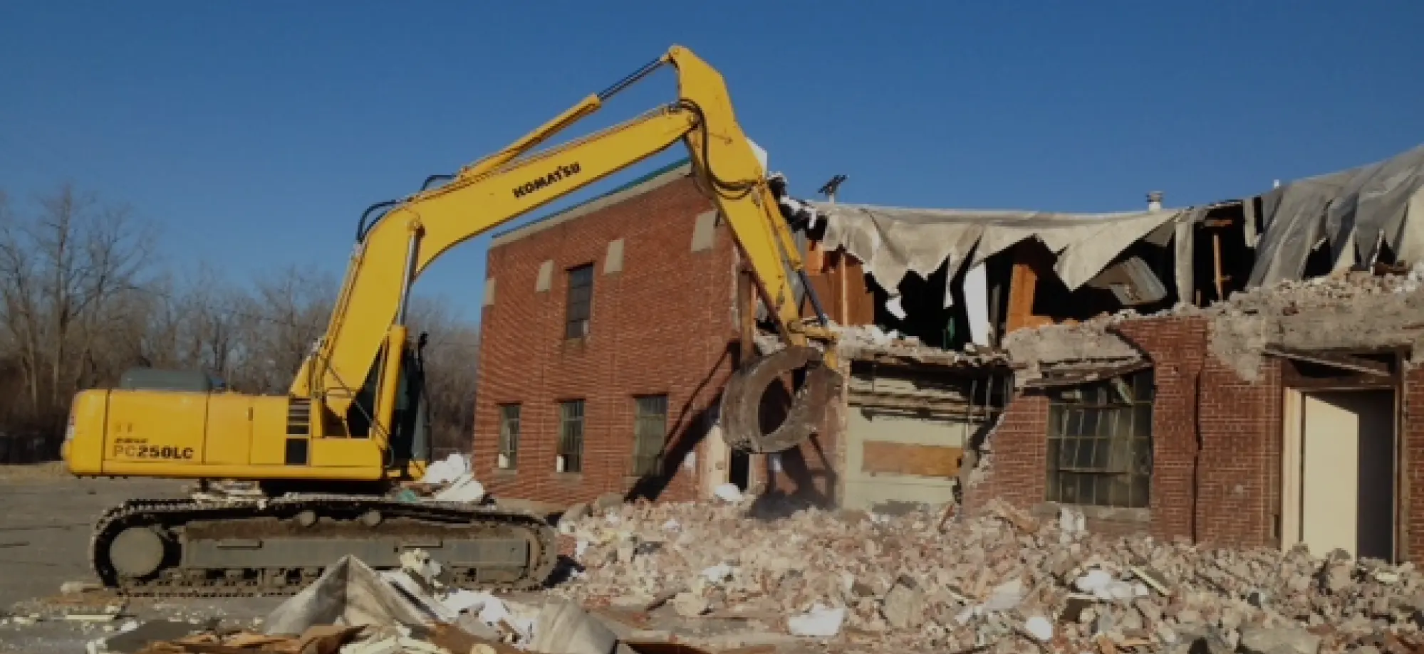 excavator destroying building overlay