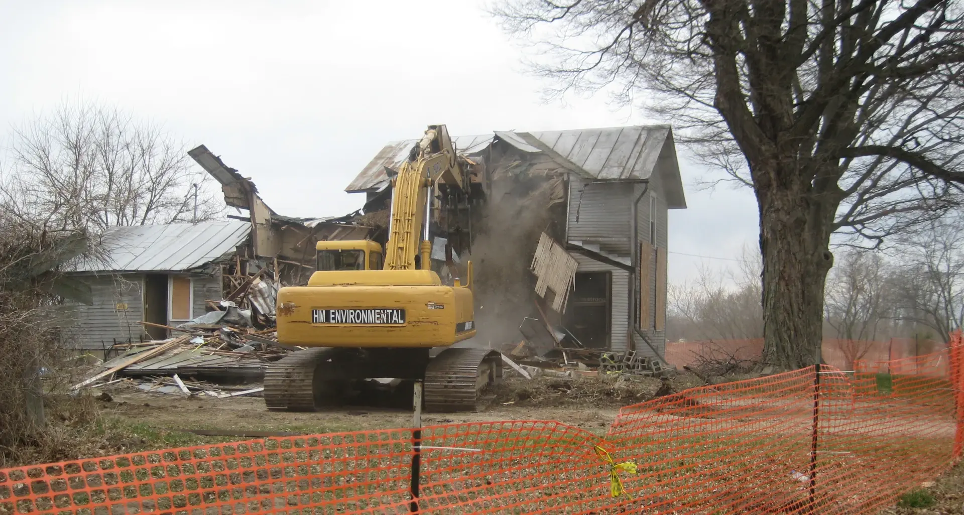 hm equipment used to demo building with caution area