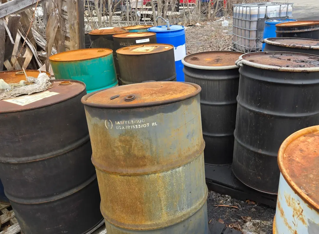 group of rusty drums together