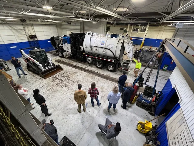 aerial demonstration of tank truck back being opened