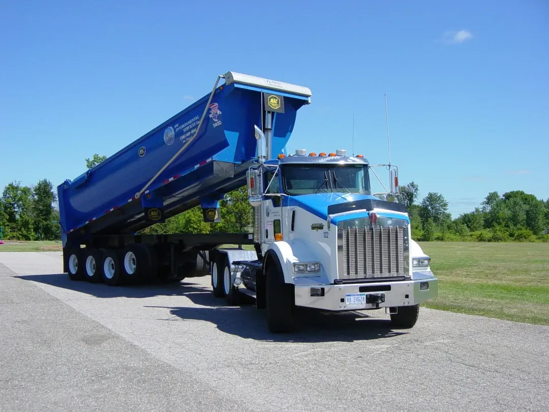 hm dump trailer truck with trailer lifted