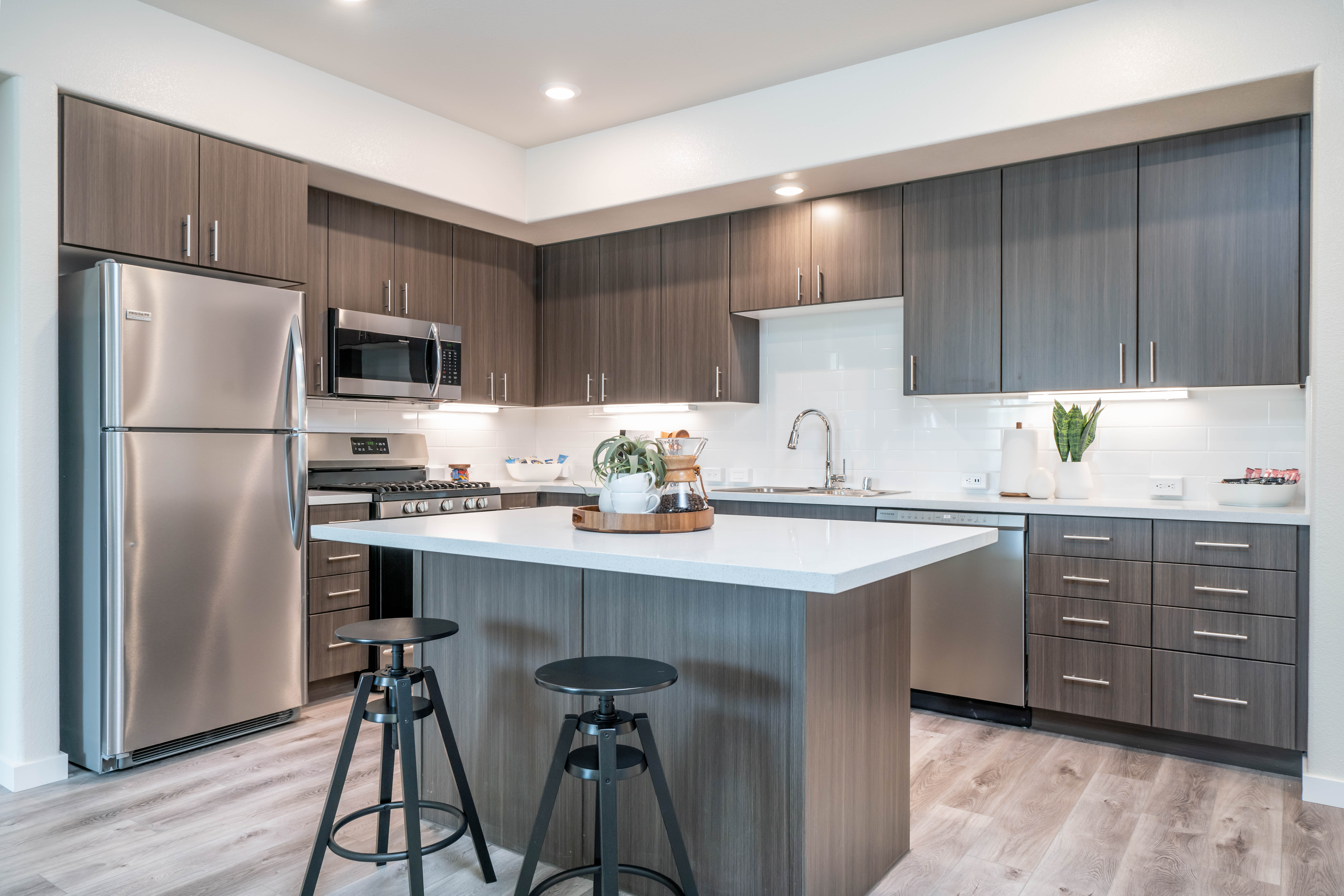 Kitchen with brown cabinetry and stainless steel appliances