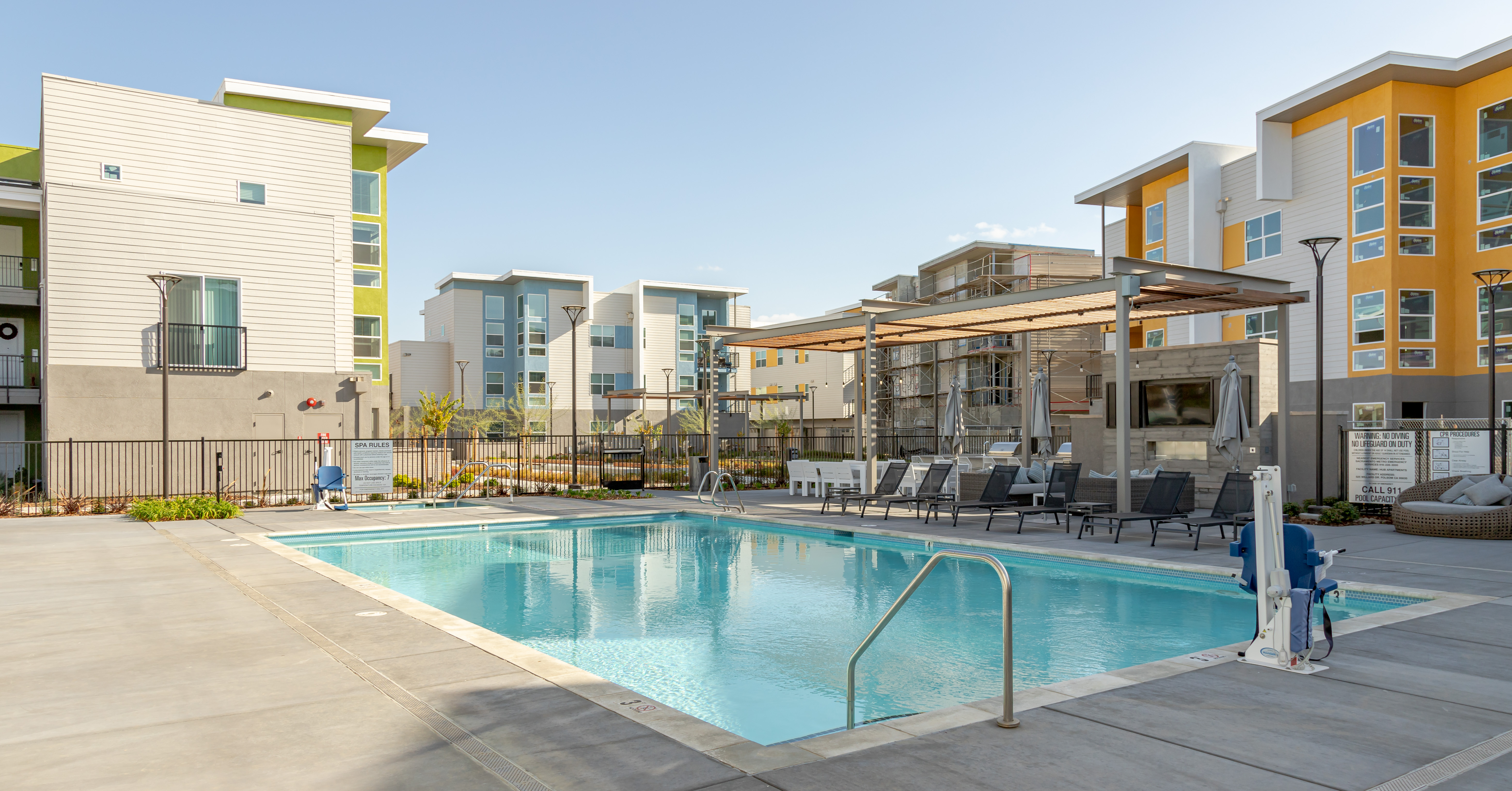 Swimming pool with lounge chairs and view of exterior
