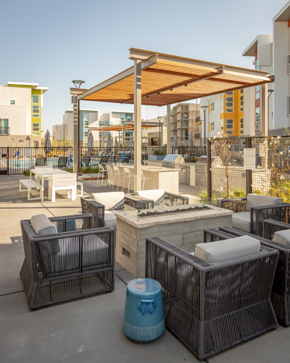 Outdoor seating area with pergola and fire pit
