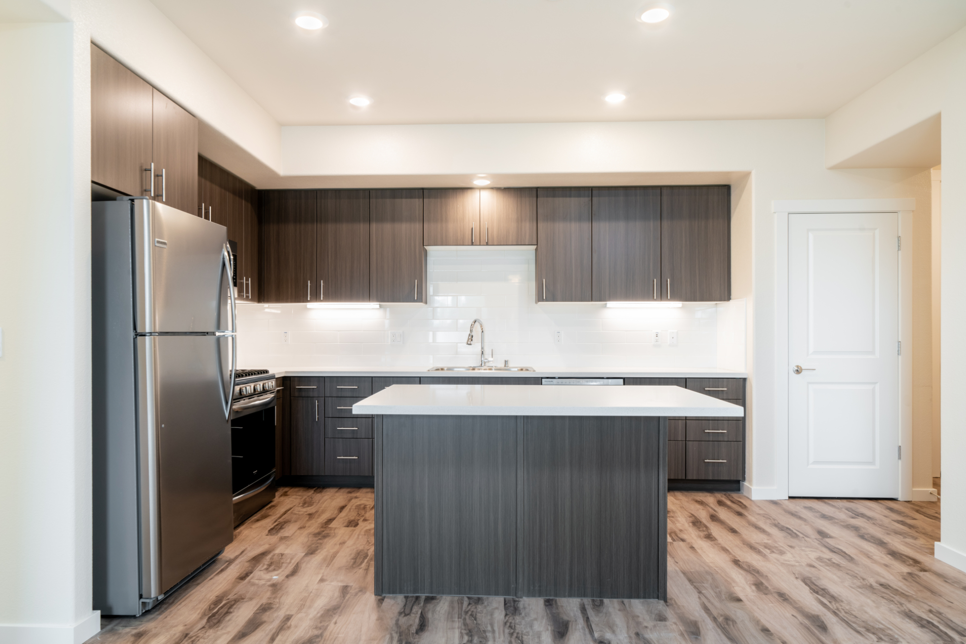 Kitchen with island and open living space