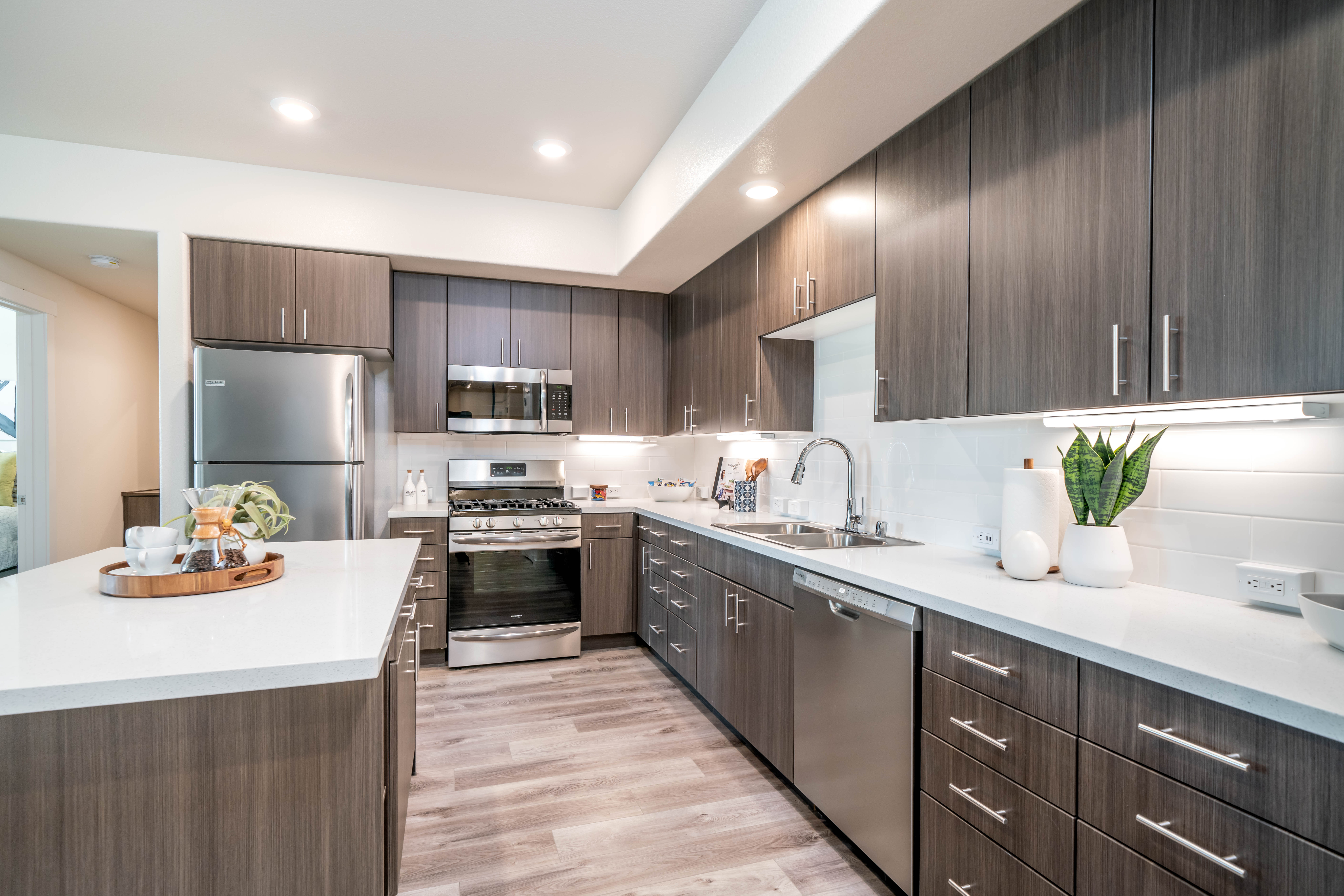 Galley kitchen with peninsula and stainless steel appliances