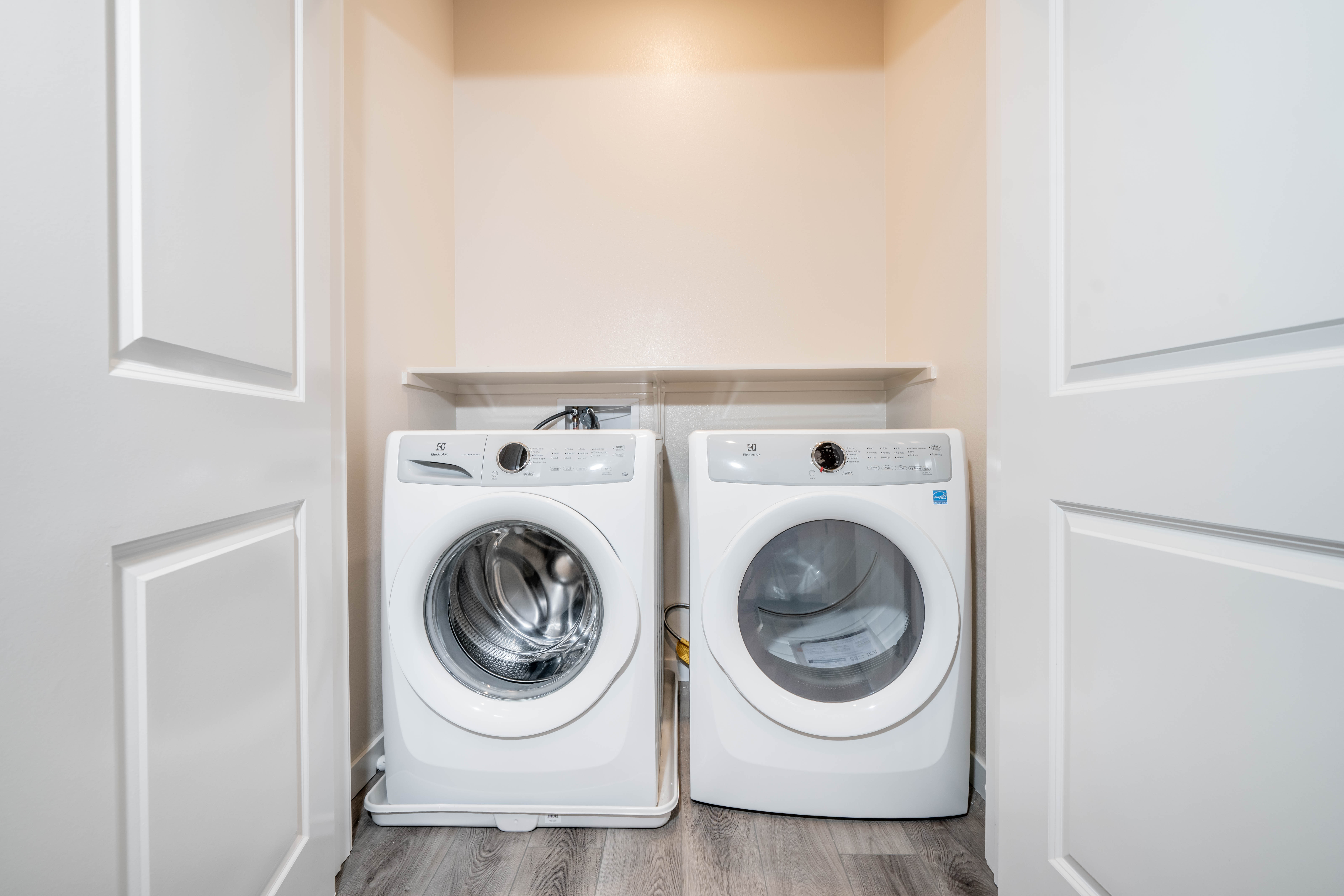 Front-loading washer and dryer in a closet nook
