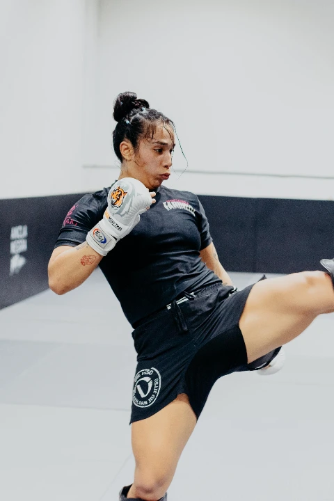Two athletes practicing Muay Thai striking techniques at Dojo Nine.