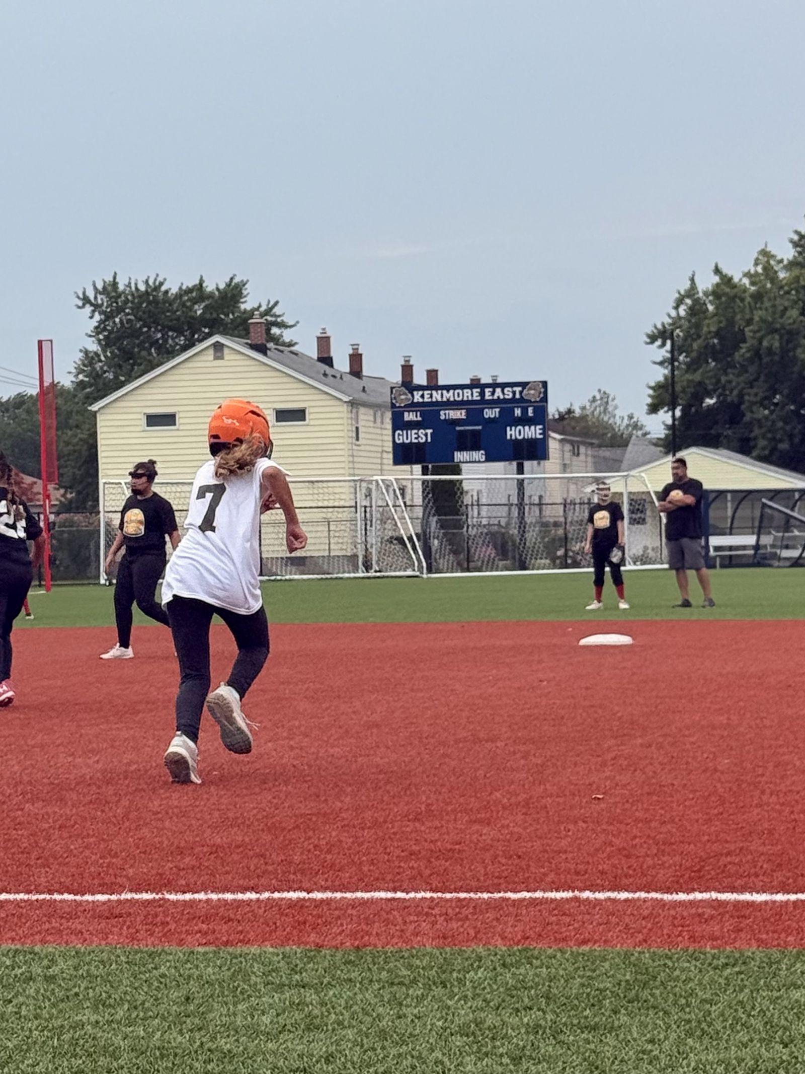 A runner rounds the base.