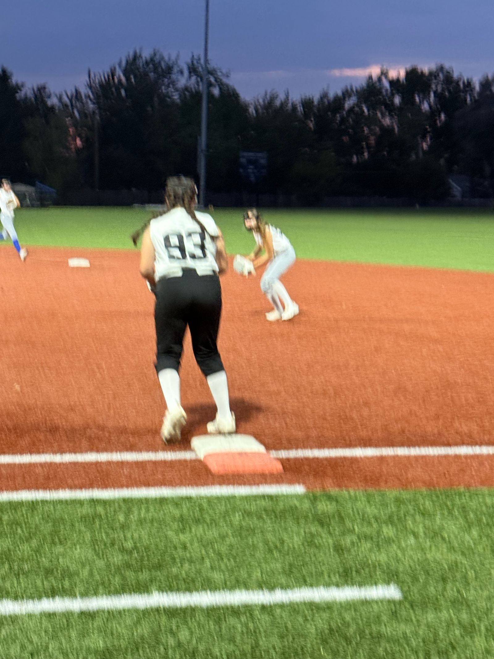 Number 83 takes her lead off first base.