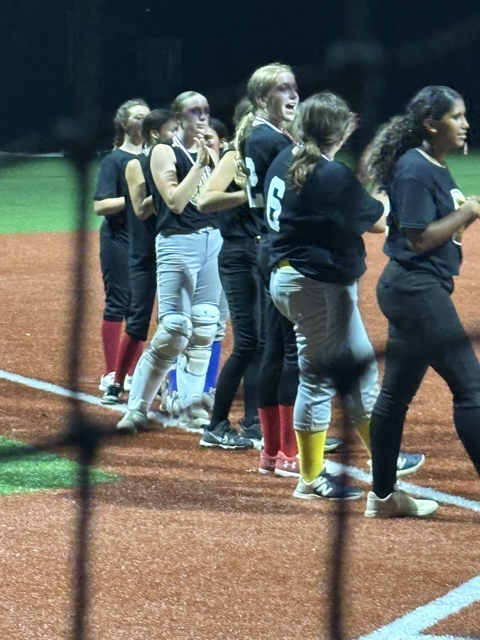 A team huddles together after the final out.