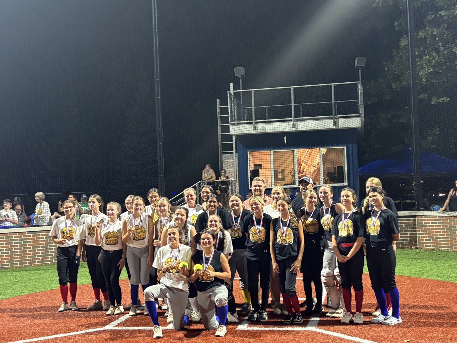Both All-Star squads with their medals after the game.