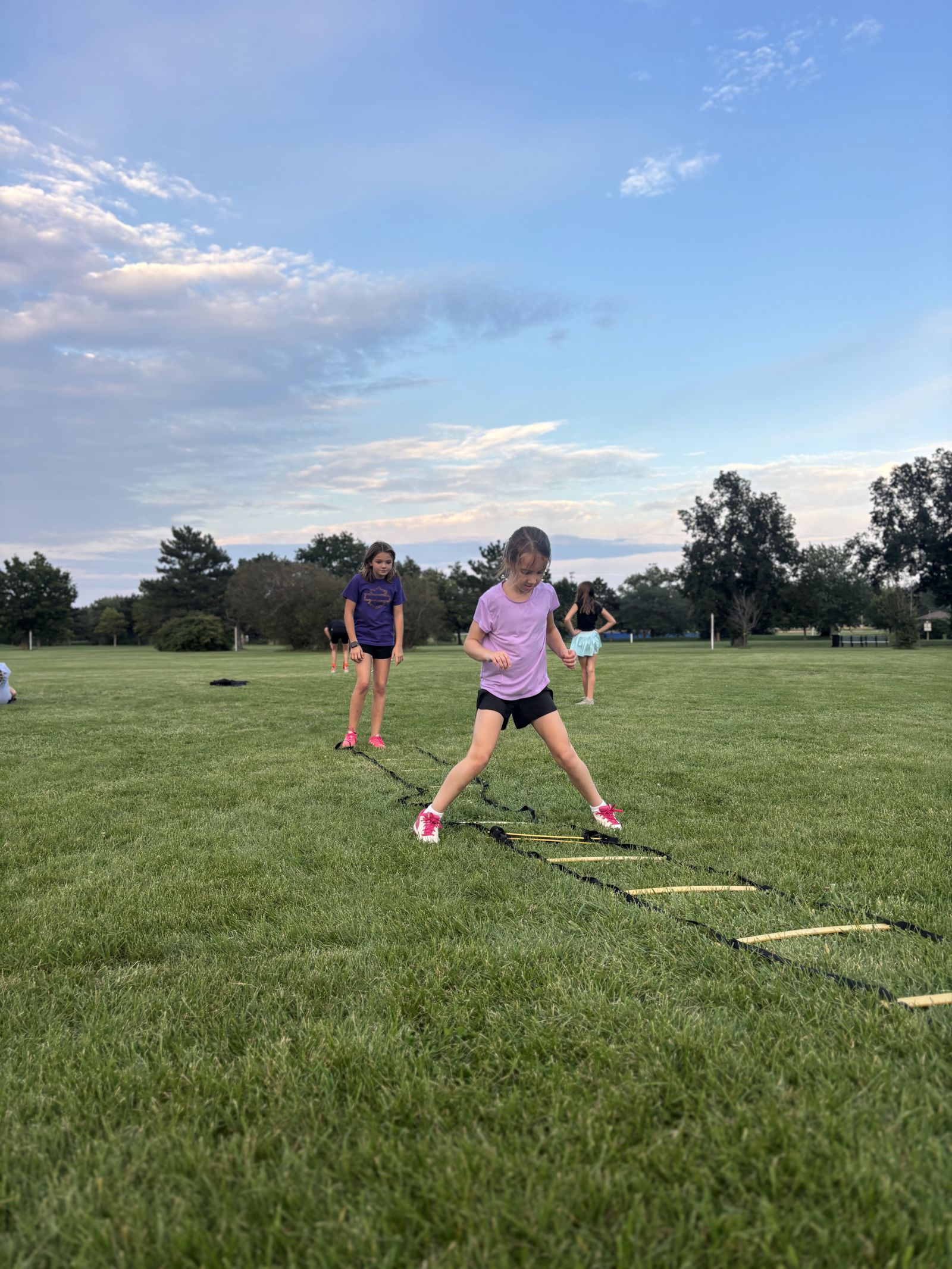 A player hops through the agility ladder.