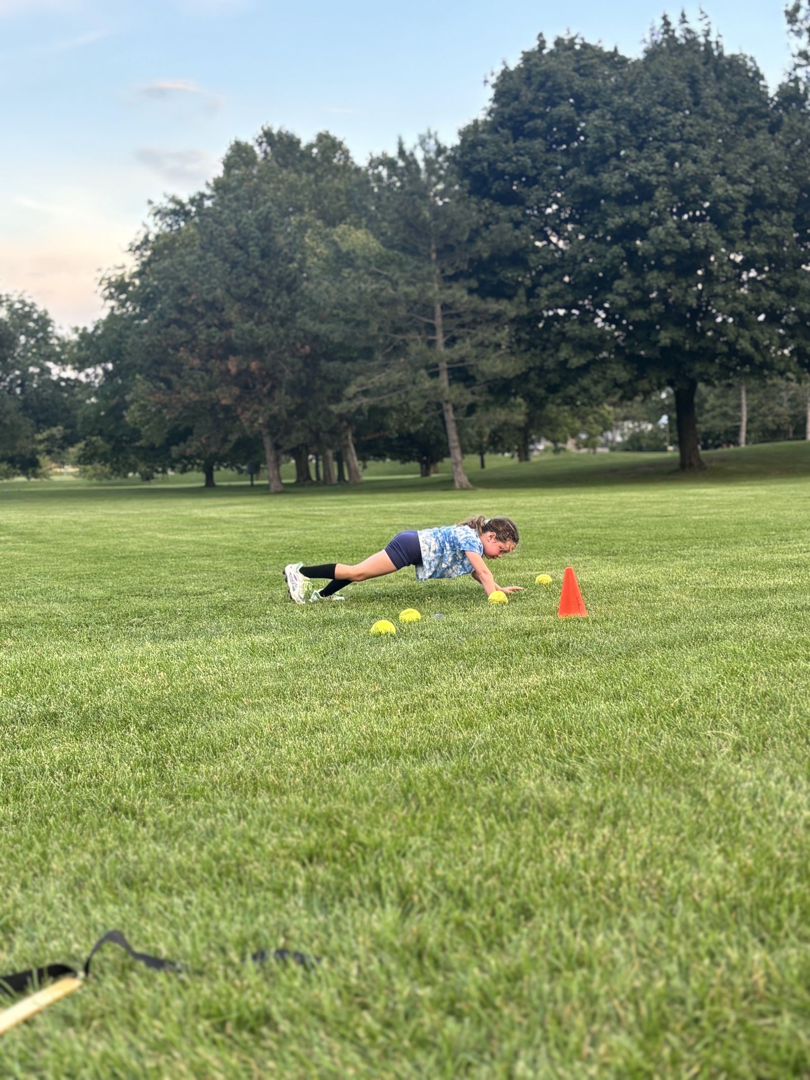 A player holds a plank during clinic conditioning.