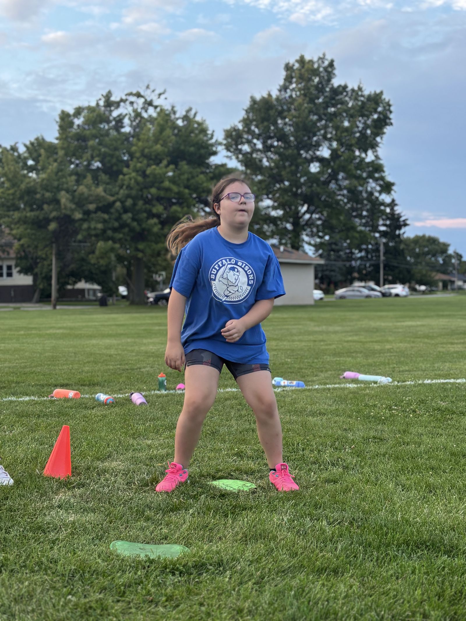 A player fields the ball at a clinic station.
