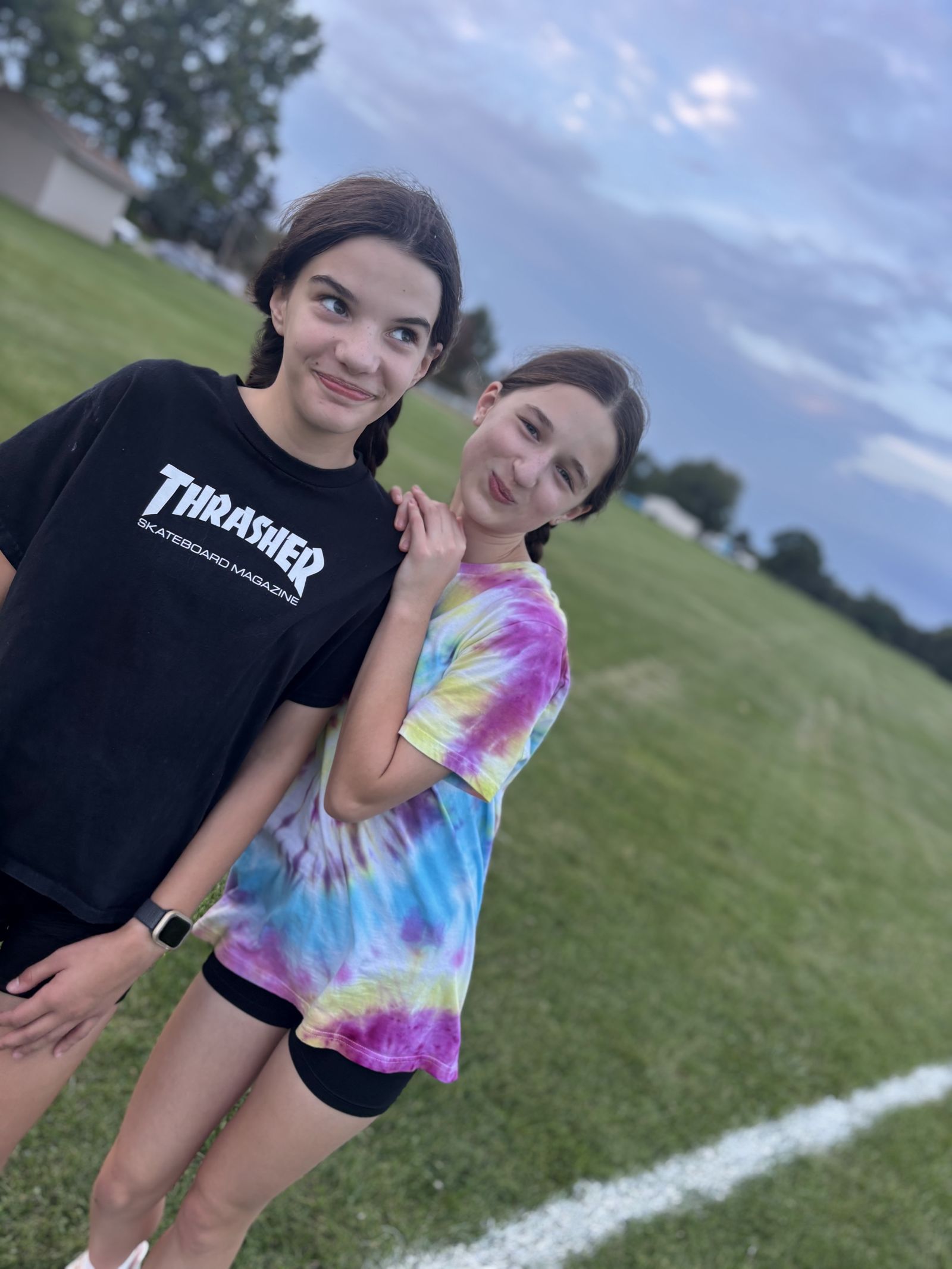 Two players pose together at the end of a clinic.
