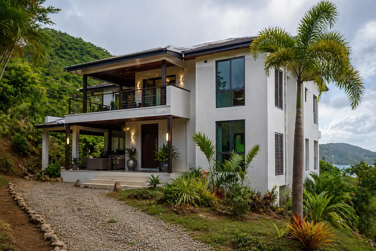 two-story modern residential home on the hill overlooking the water