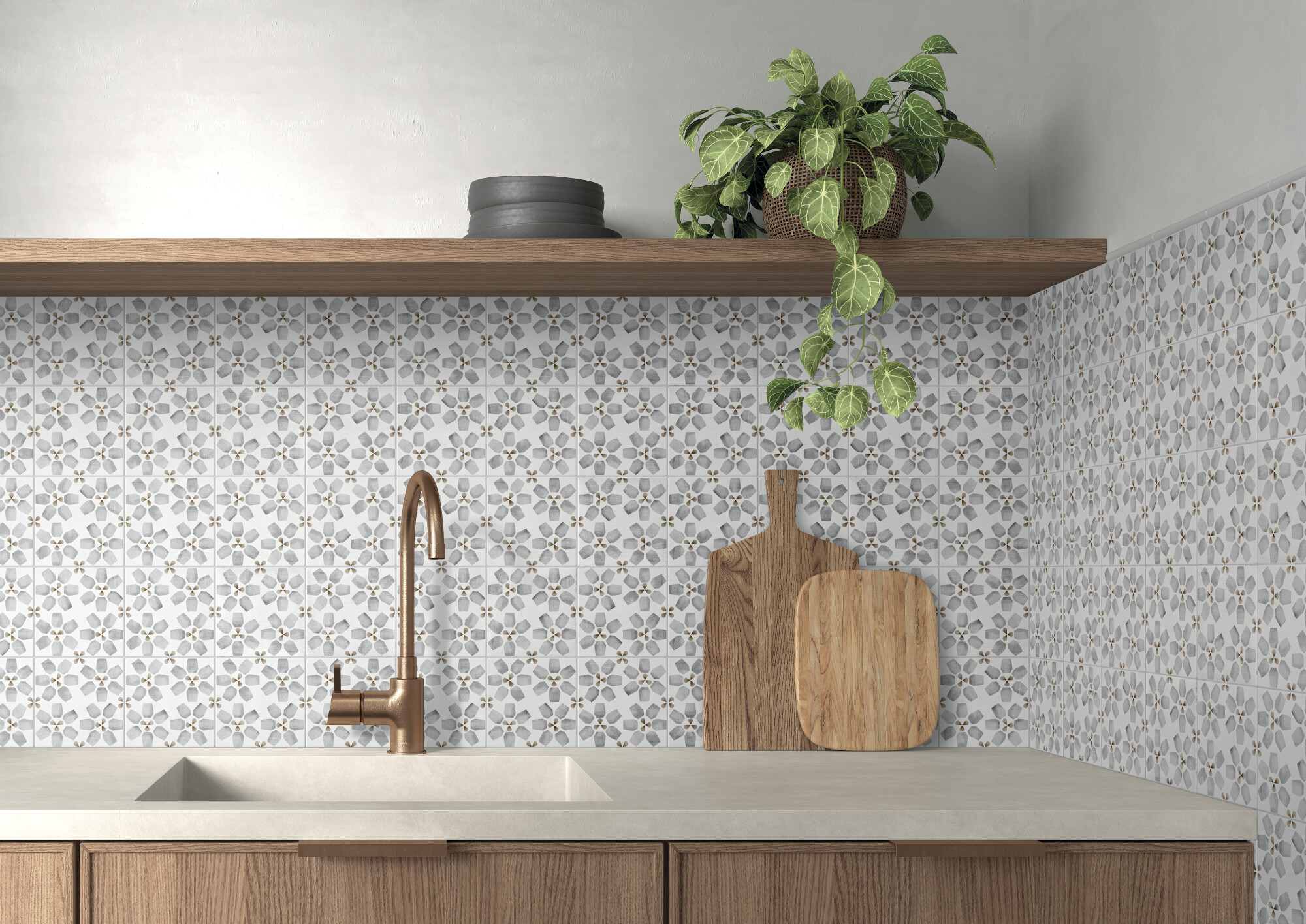 Kitchen sink with bronze faucet, floral patterned tile backsplash, wooden shelf with plant and bowls.