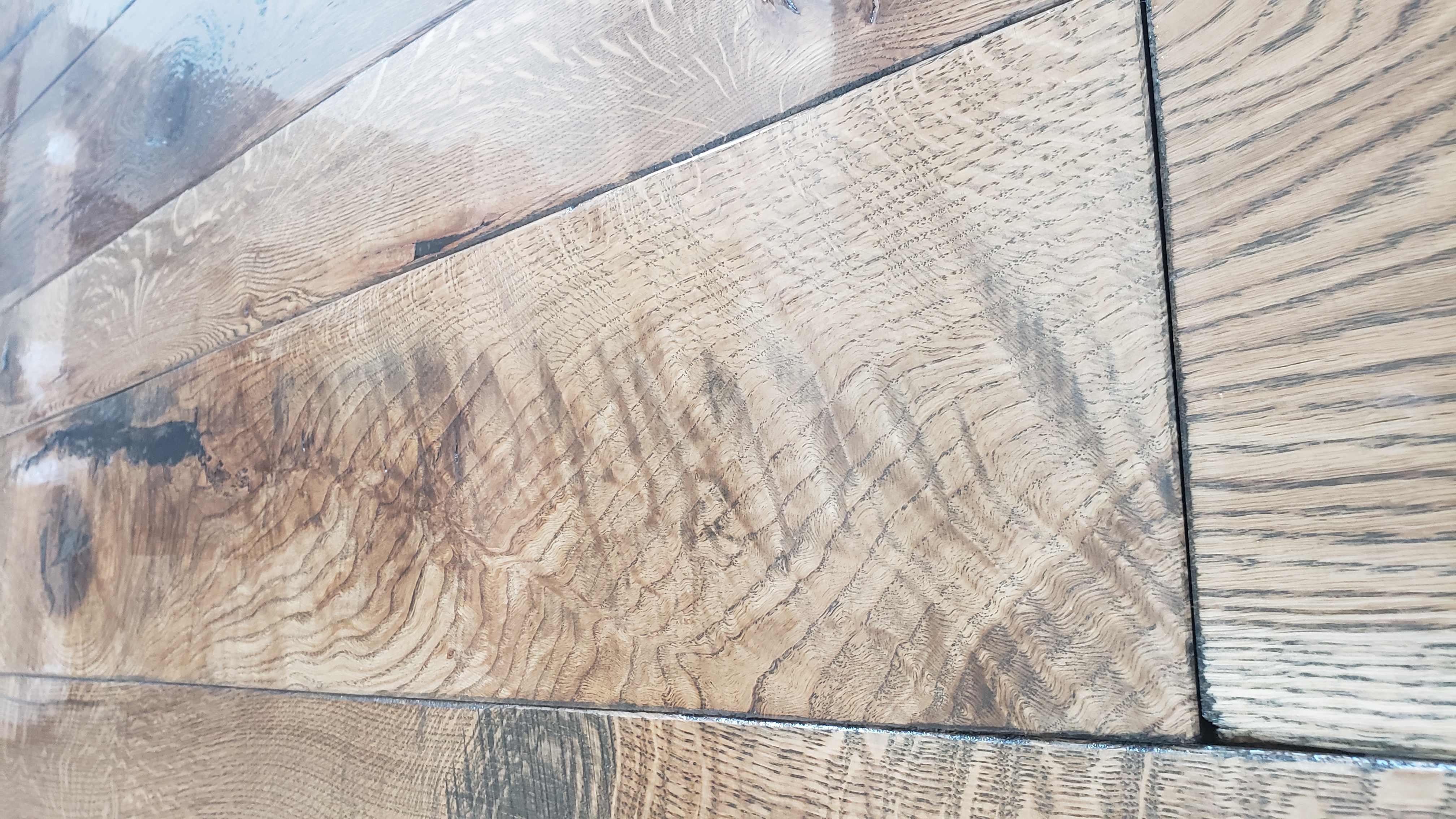 Close-up of textured wooden floorboards with natural grain patterns and finish.