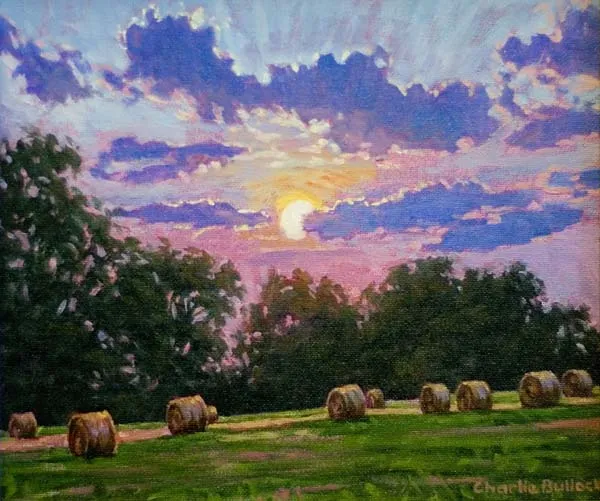 Sunset Over Hay Rolls