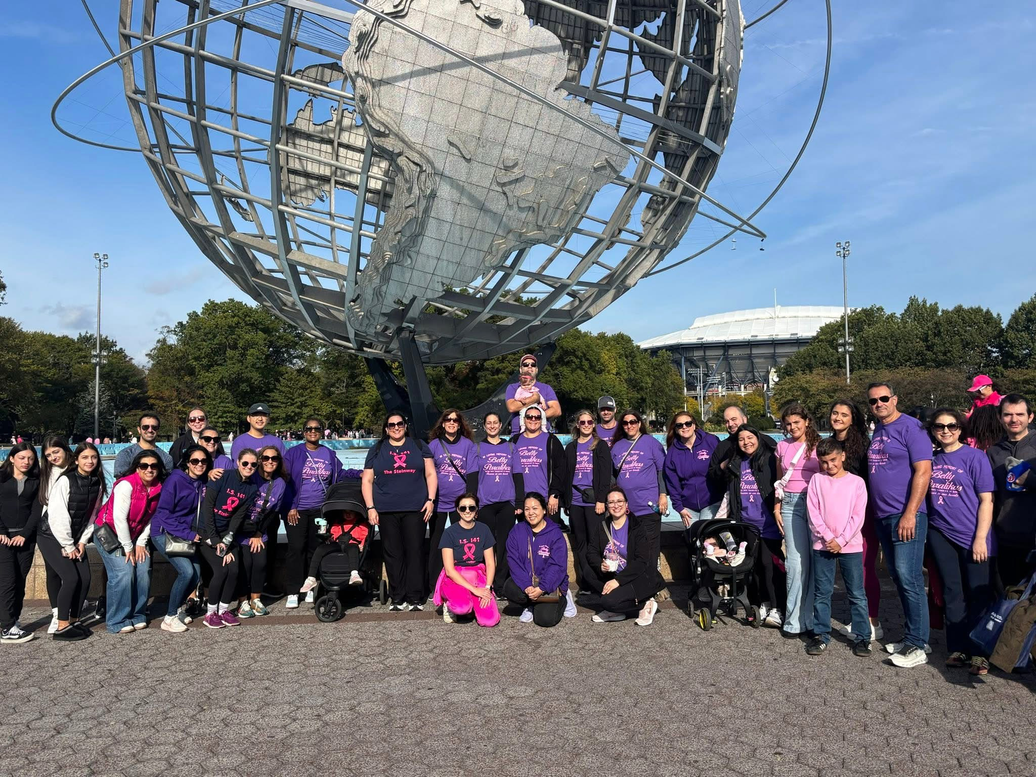 School community group in purple shirts at Unisphere Queens charity walk