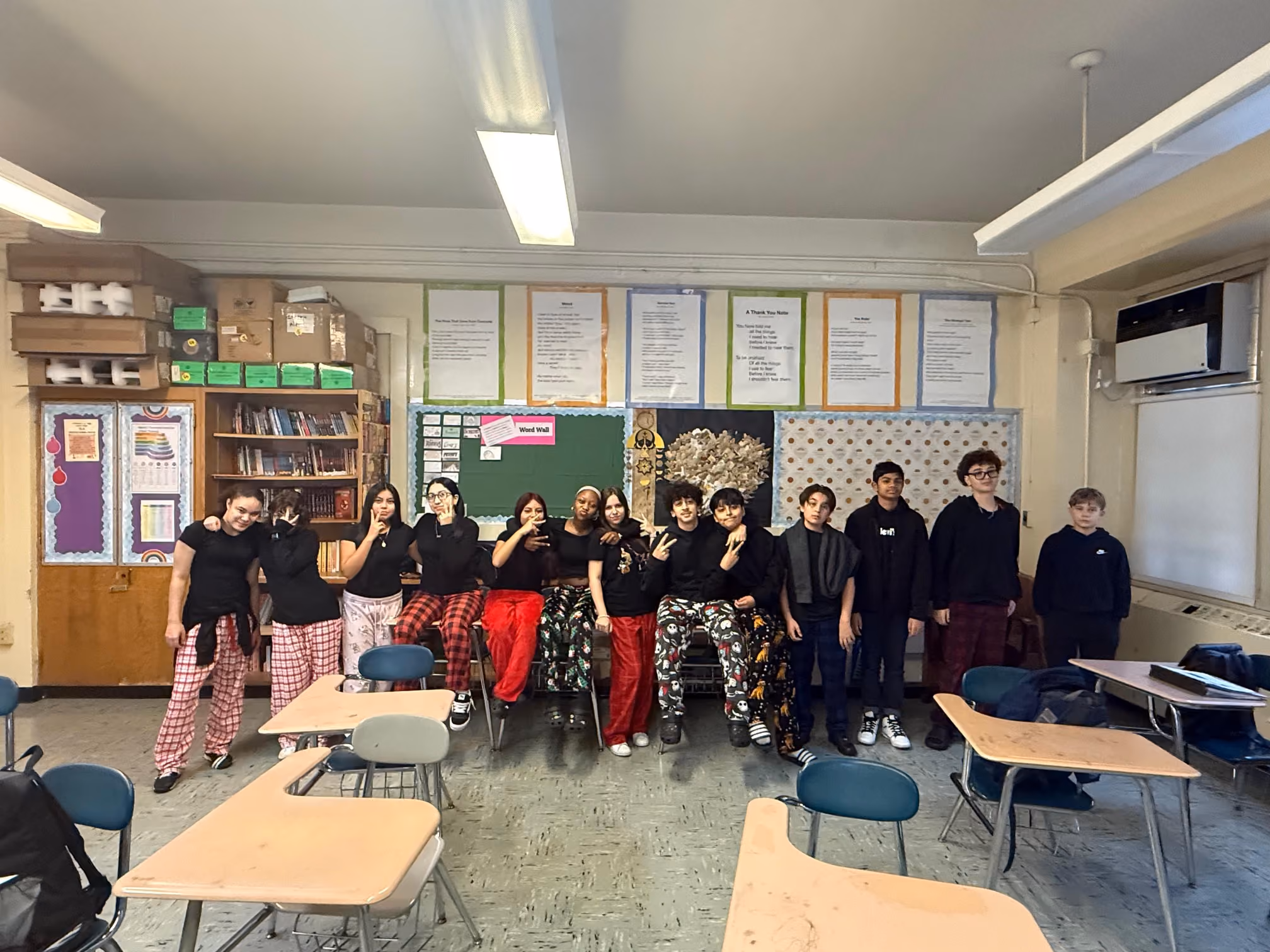 Students posing in pajama pants during classroom spirit day