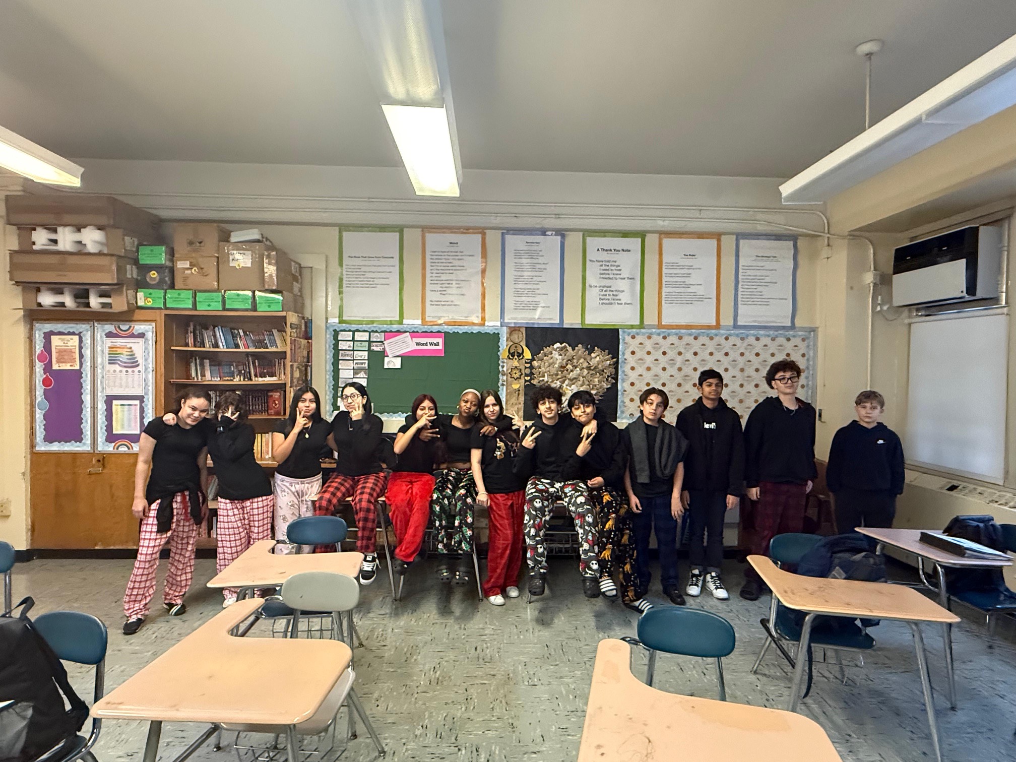 Students posing in pajama pants during classroom spirit day